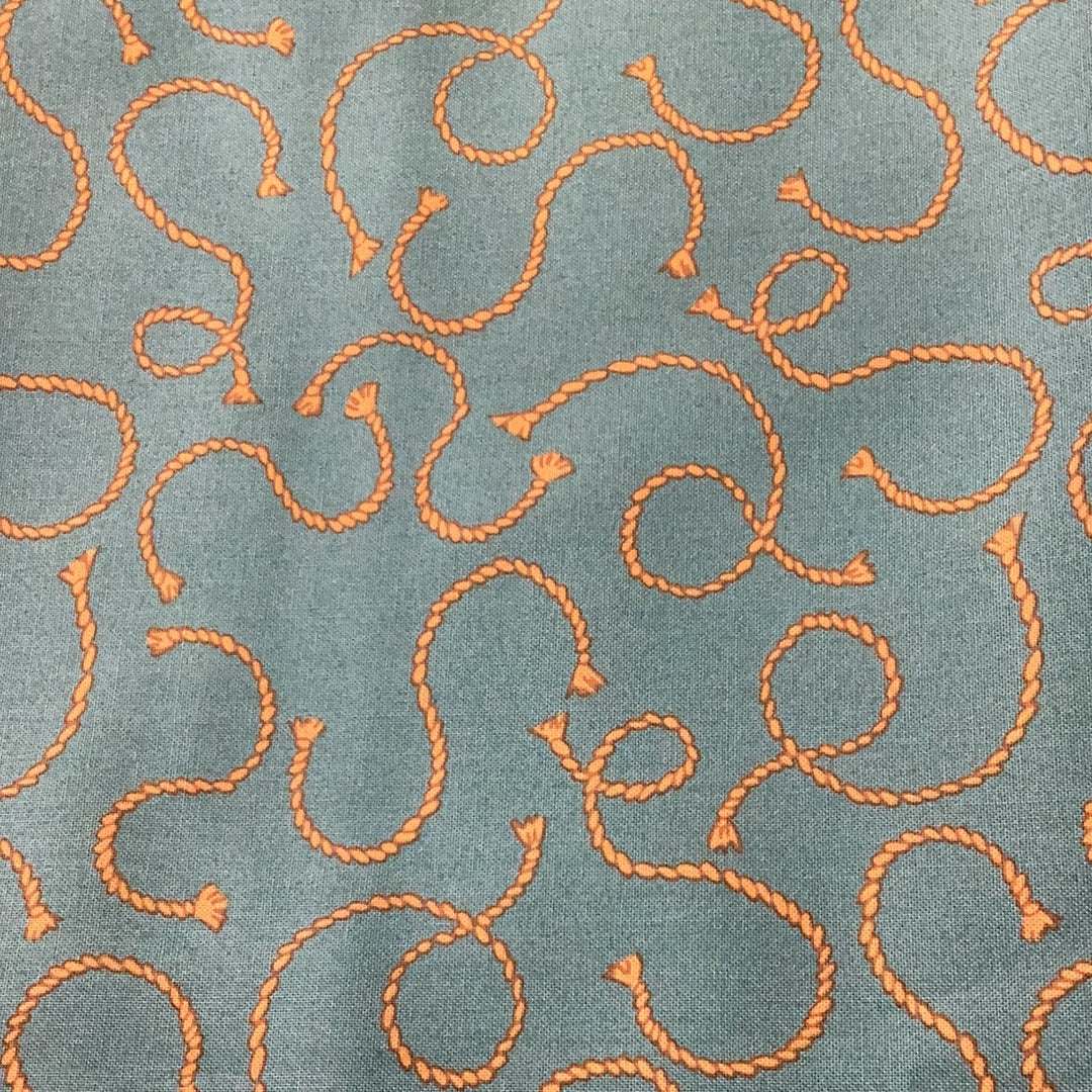 Sale Backing BB39 fabric with orange rope pattern on blue background
