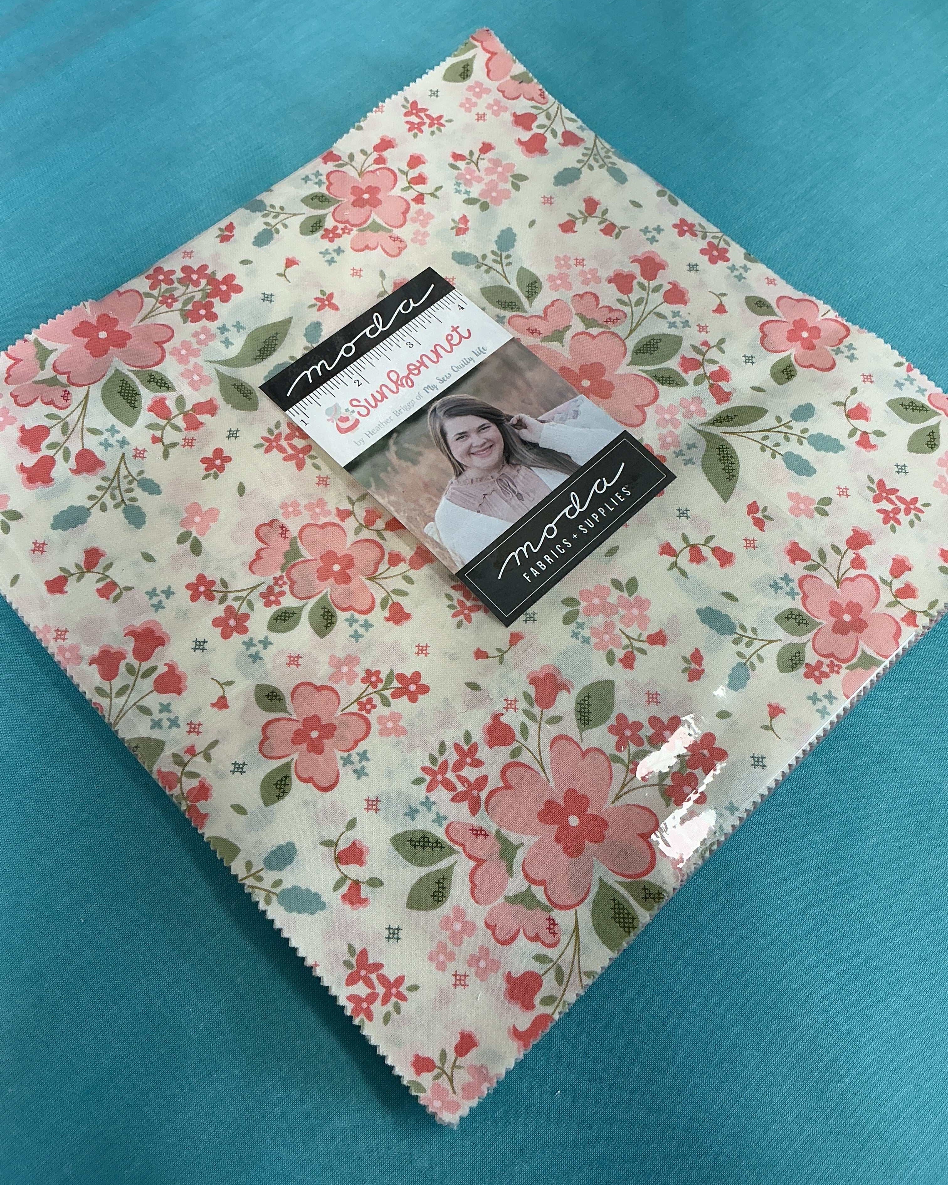 Frida Lap Size Quilt Kit with fabrics, pattern, accent, and binding for sunbonnet quilt sewing project