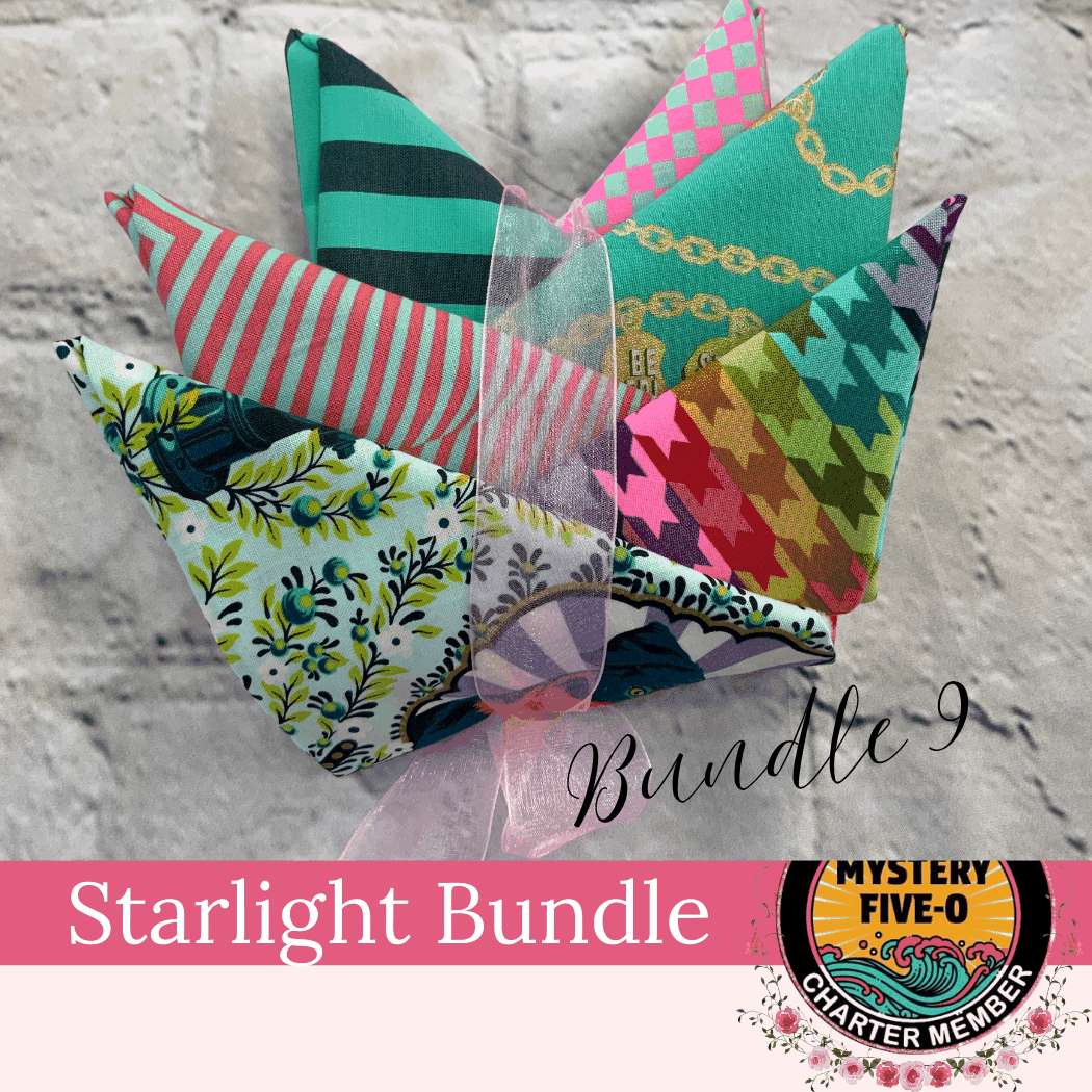 M50 Bella Rose Quilts Starlight Fat Quarter Bundle with six colorful patterned fabrics tied with pink ribbon