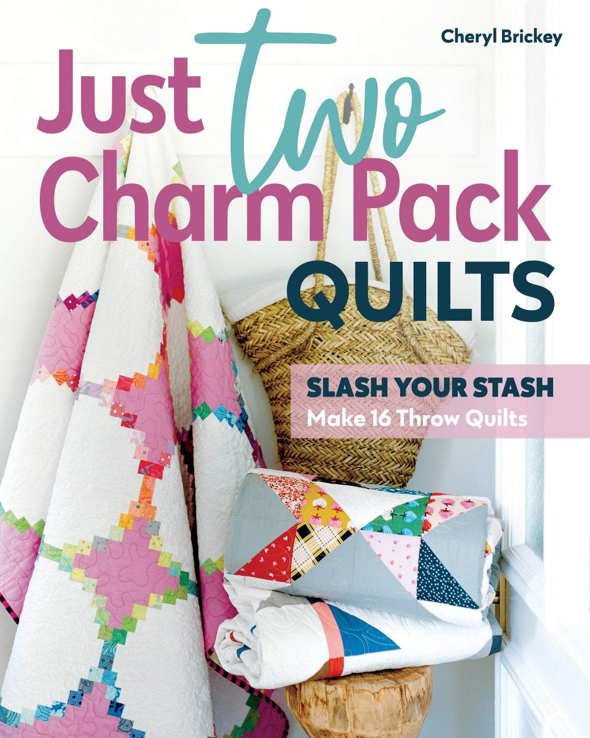 Two colorful quilts made from just two charm packs displayed on a wooden surface
