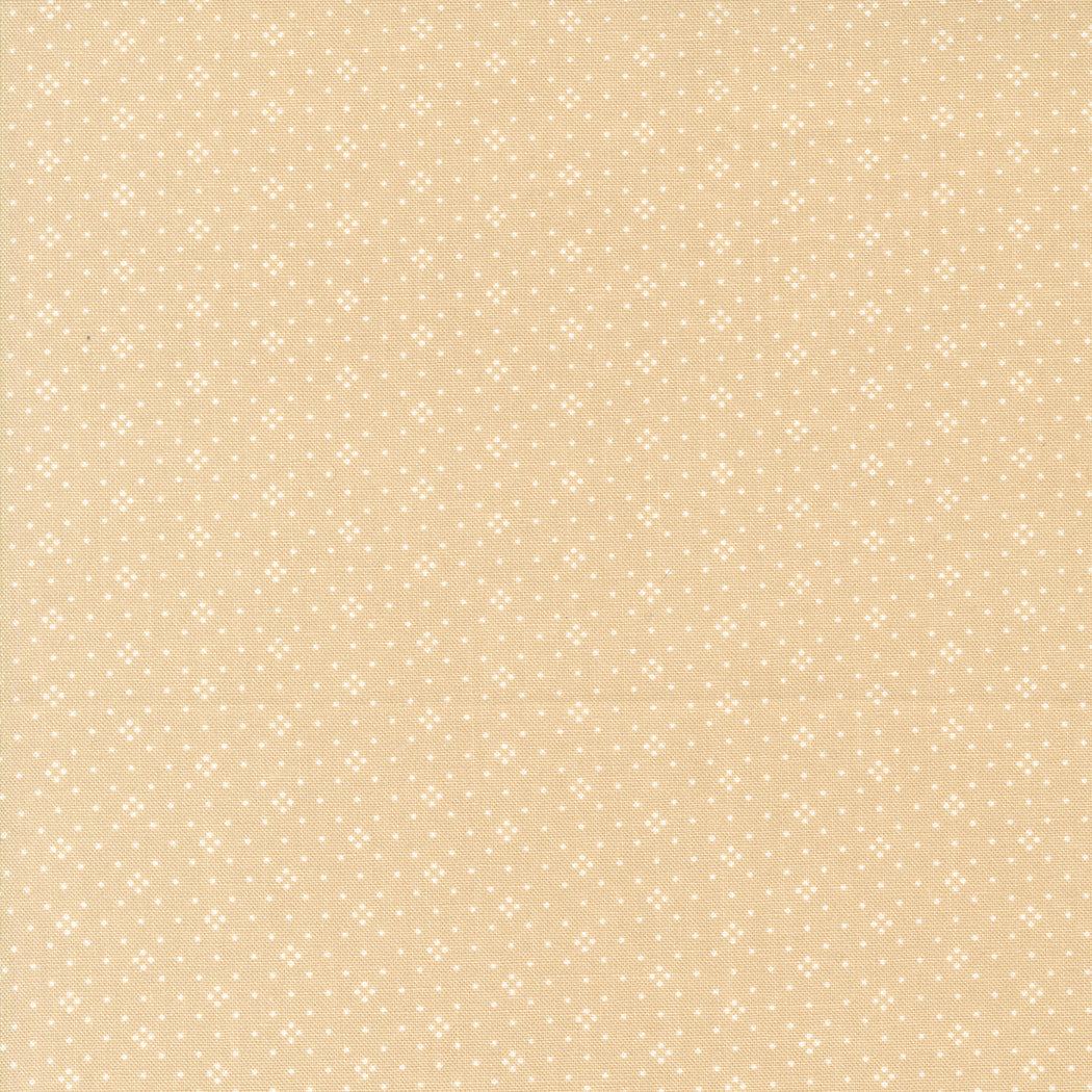 Eyelet by Fig Tree & Co latte fabric with small white dot pattern for shirting by Moda Fabrics