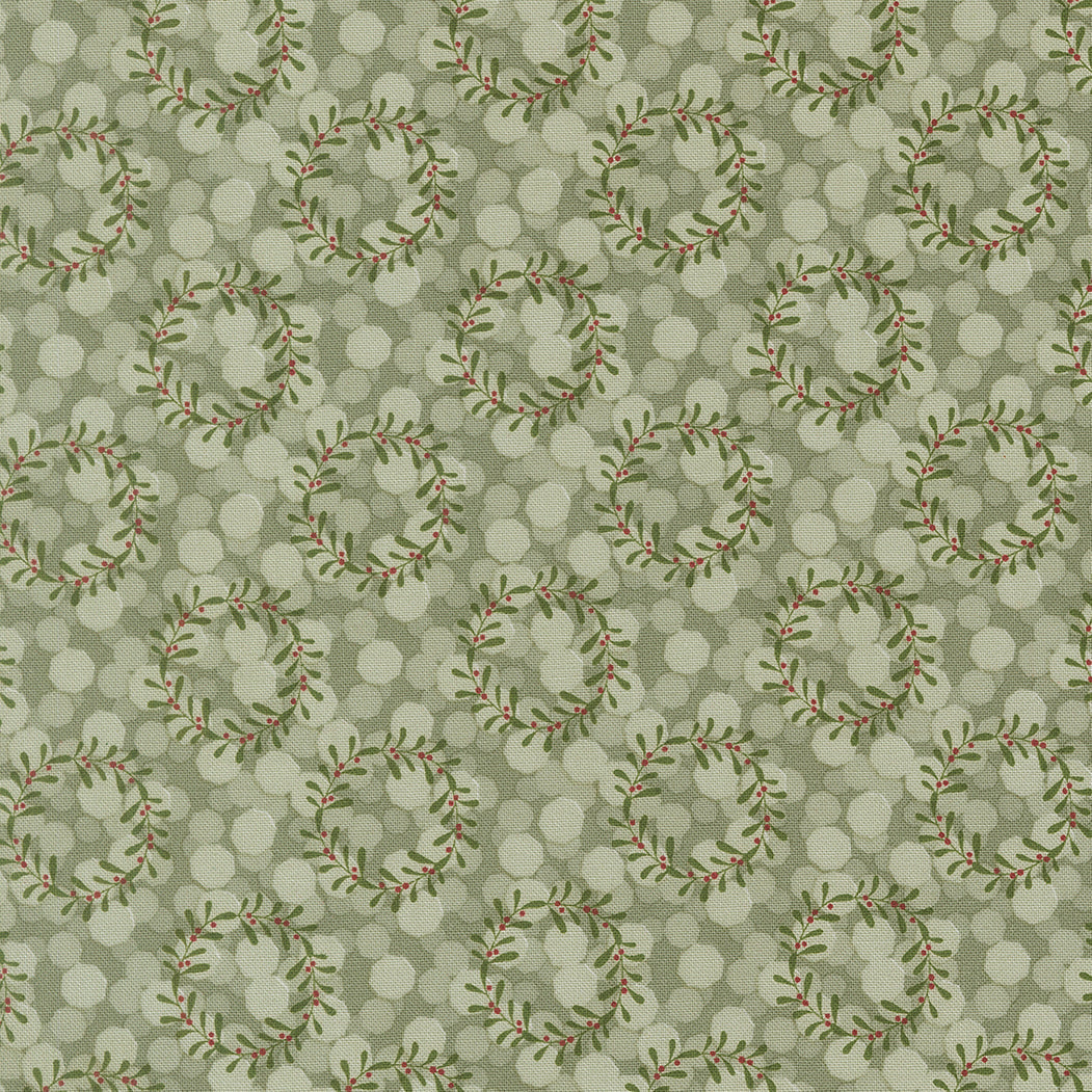 Gingerbread Lane Christmas fabric with glittering lights, mistletoe, and gingerbread houses by Kiley Ferons for Moda Fabrics