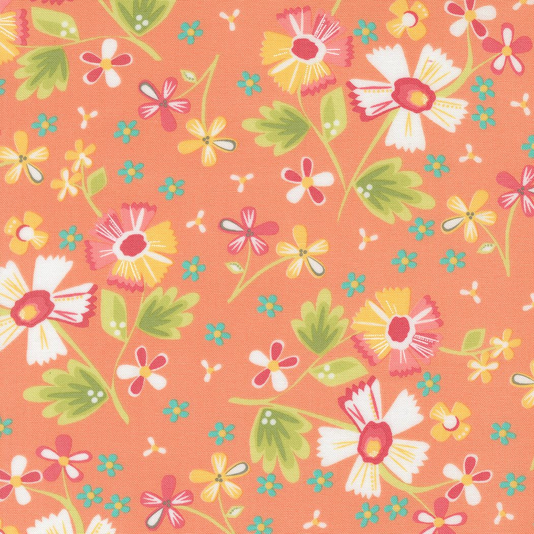 In the Garden coral floral fabric by Corey Yoder with daisies and green leaves on coral background