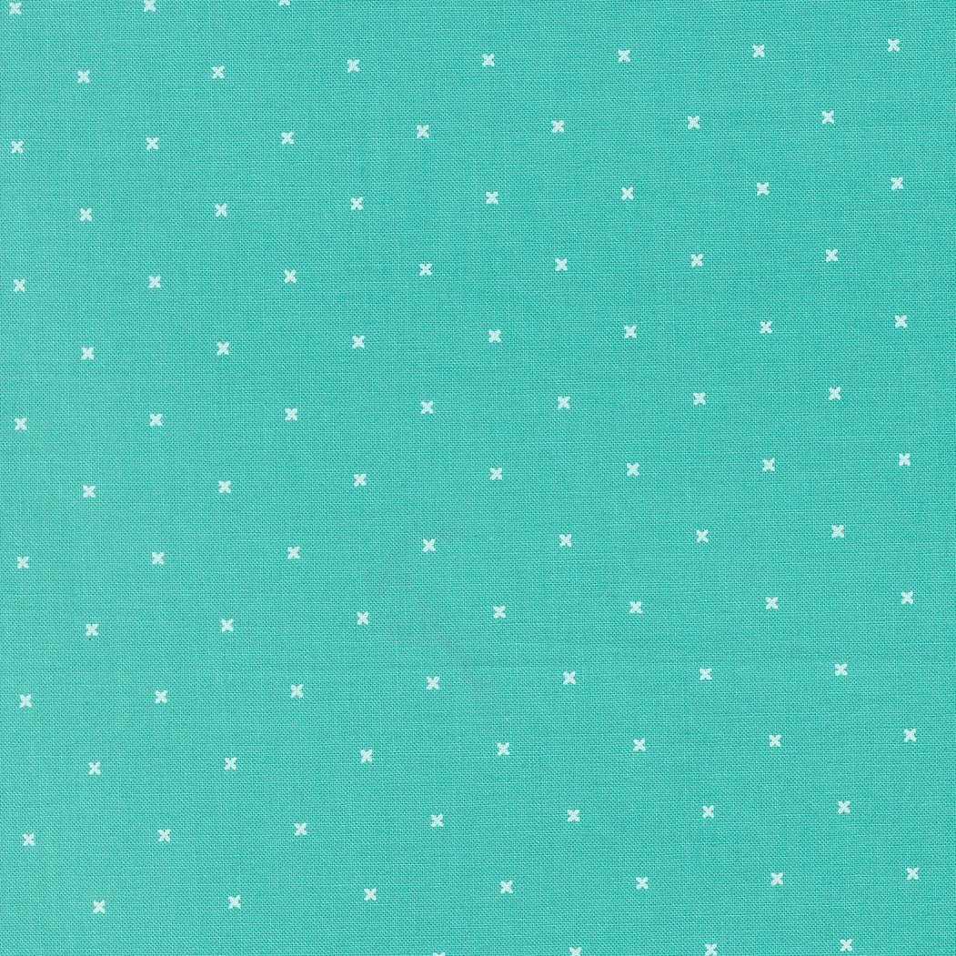 Tiny Peel Bermuda fabric with small white crosses on aqua background by Corey Yoder for Moda Fabrics