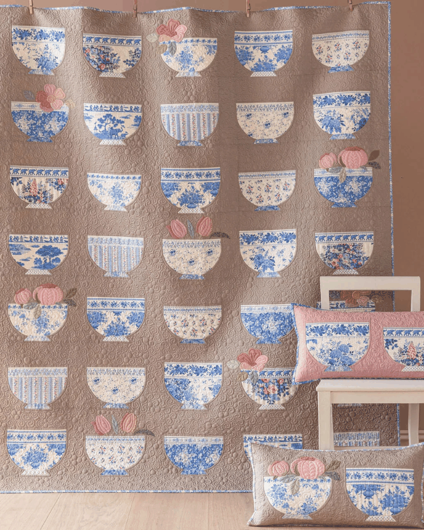 Bowl Collection Quilt Kit featuring blue and white pottery bowls appliqué in two colorways, 63.5" x 75.25"