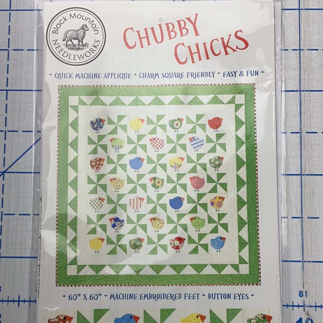 Chubby Chicks quilt pattern by Black Mountain Needlework with applique chick designs and green pinwheel border