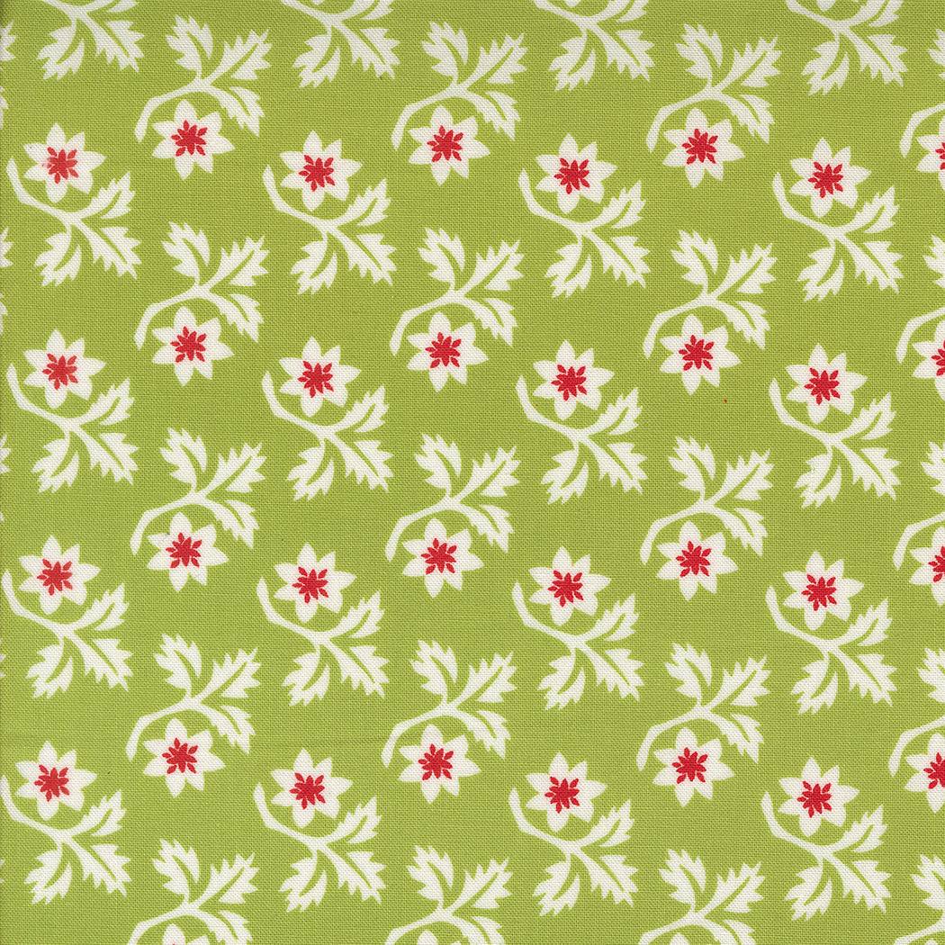 Buon Natale fabric with white and red woodcut floral pattern on green background by Moda Fabrics