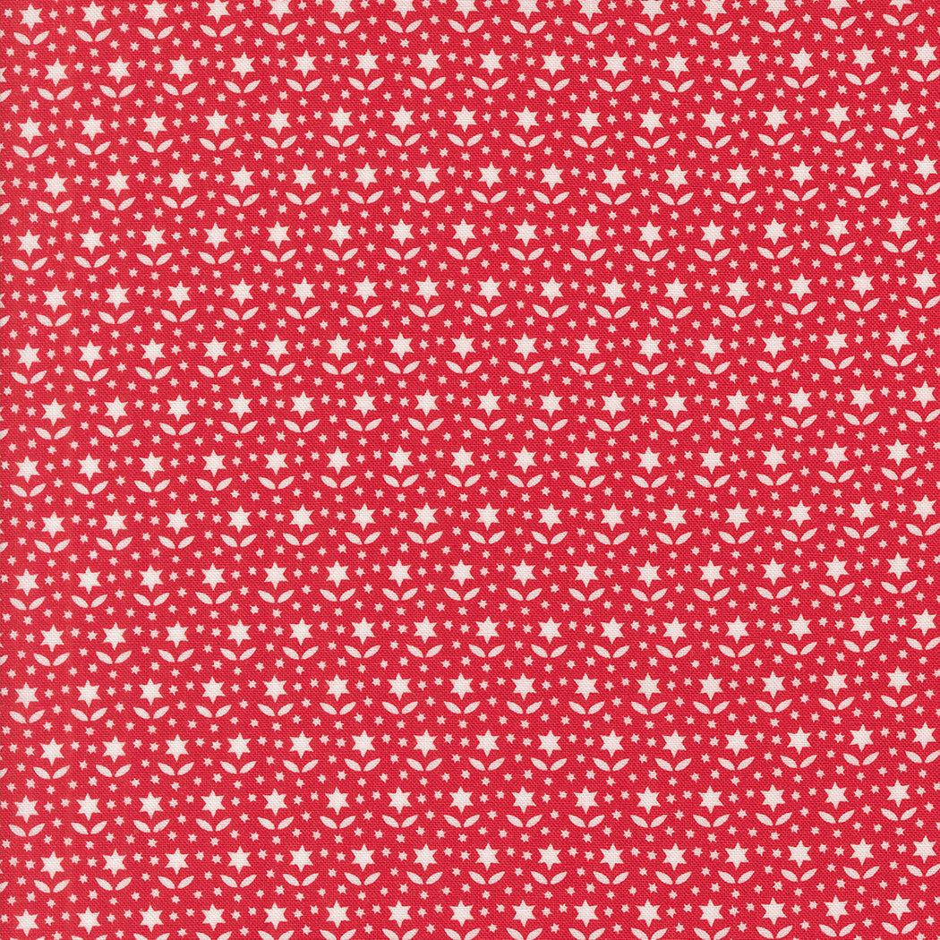Buon Natale red cotton fabric with white star blooms pattern by Joanna Figueroa for Moda Fabrics
