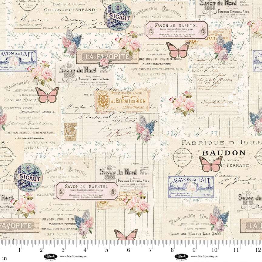 Parisian Snippets fabric by Frank Garcia with vintage labels, butterflies, and floral patterns in pastel tones
