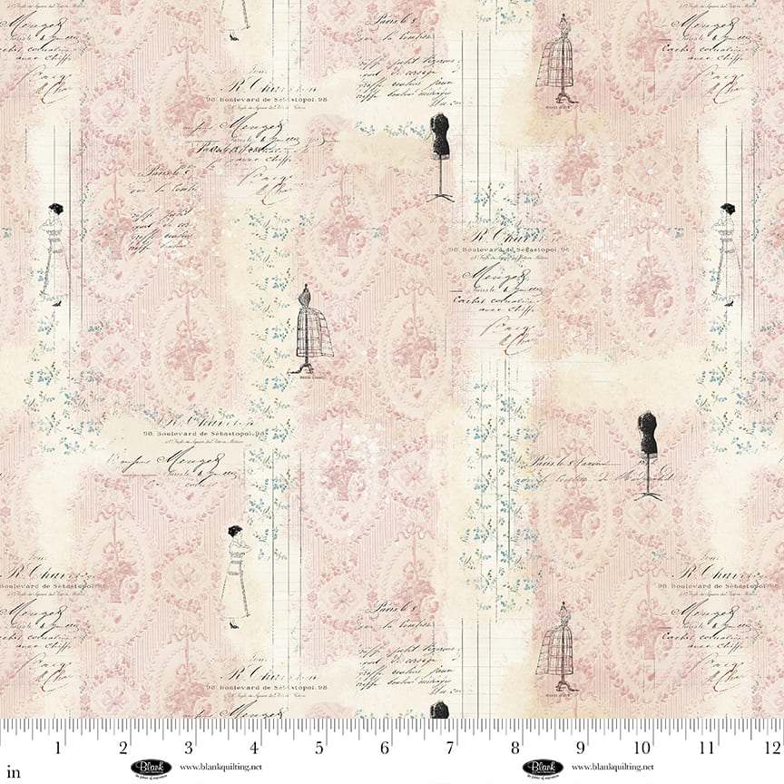 Parisian Snippets fabric by Frank Garcia with pastel mannequin and script design in pink and cream tones