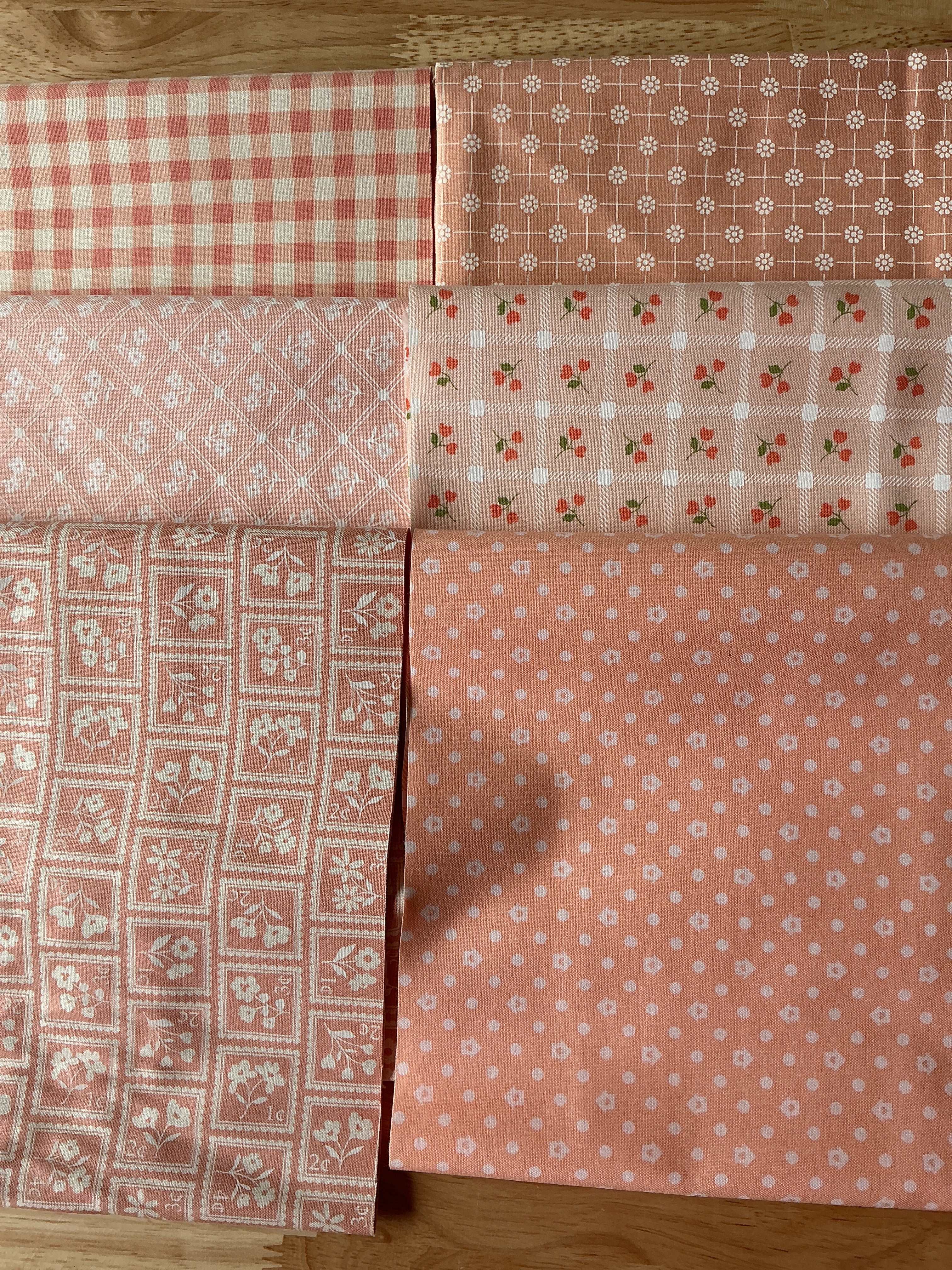 Six quarter yard cuts of Heather Briggs Quarter Yard Color Bundle fabrics from My Sew Quilty Life
