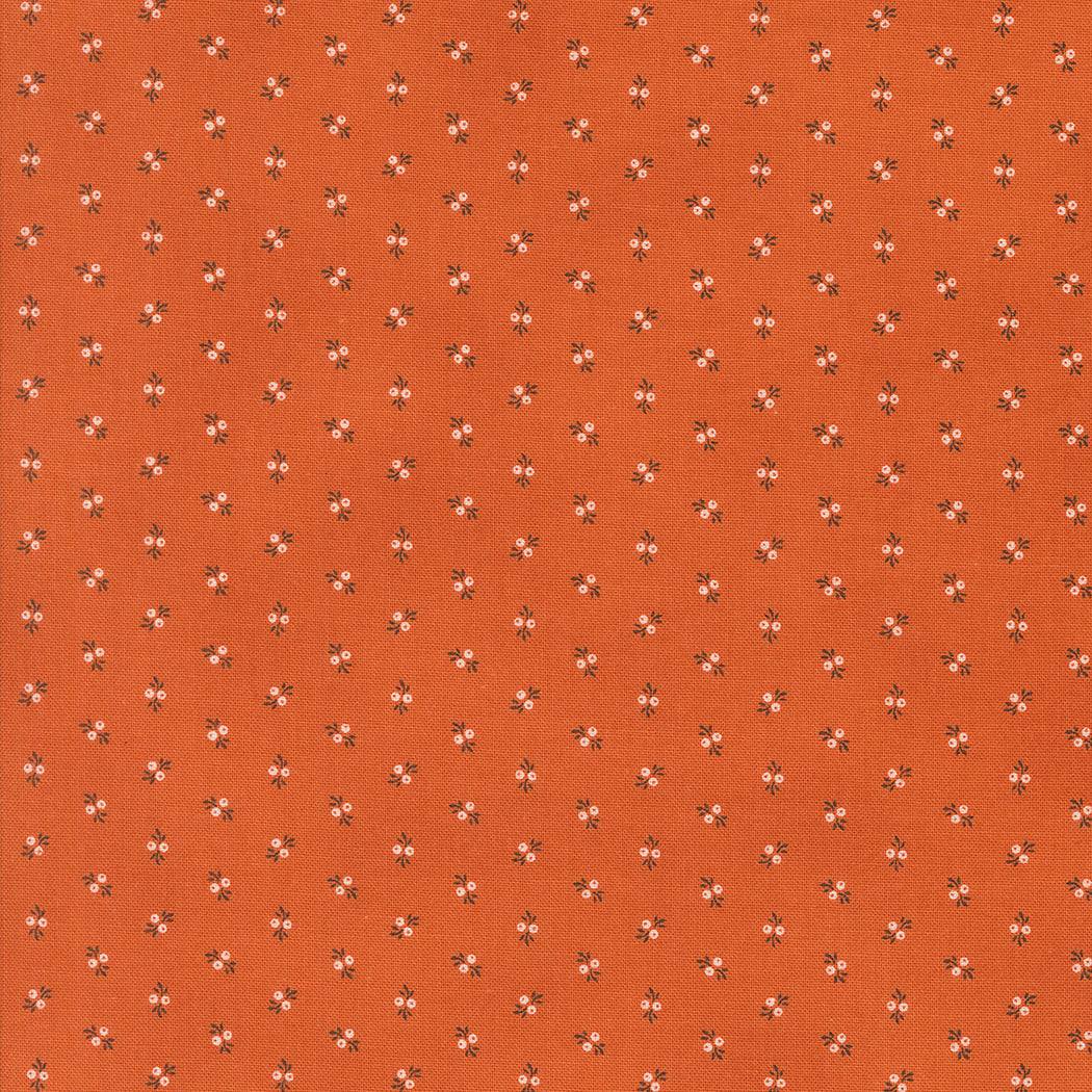 Pumpkin Spice fabric by Lisa Bongean for Moda with small floral ditsy print on orange background