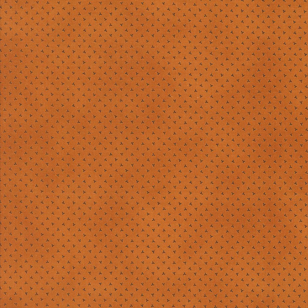 Pumpkin Spice autumn-themed orange cotton fabric with small black ditsy print by Lisa Bongean for Moda Fabrics