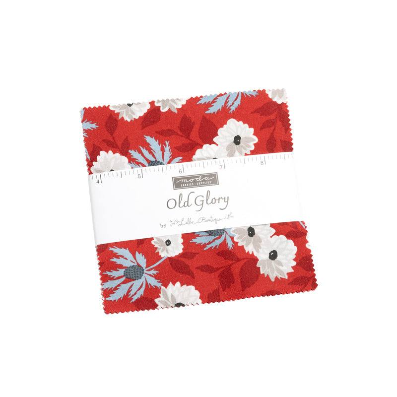 Old Glory Charm Pack patriotic fabric squares with stars, stripes, and florals in red, white, and blue by Lella Boutique for Moda