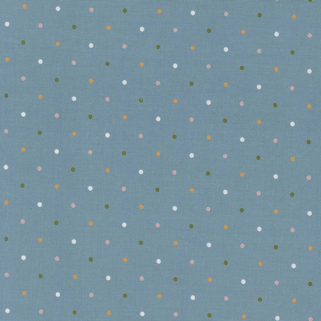 Blue fabric with small multicolored dots from Wild Honey Magic Dot Breeze collection by Lella Boutique