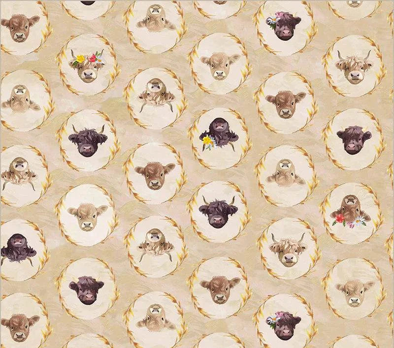 Highland Hooves fabric with adorable highland cow faces in wreaths on wheat cotton background by Whistler Studios