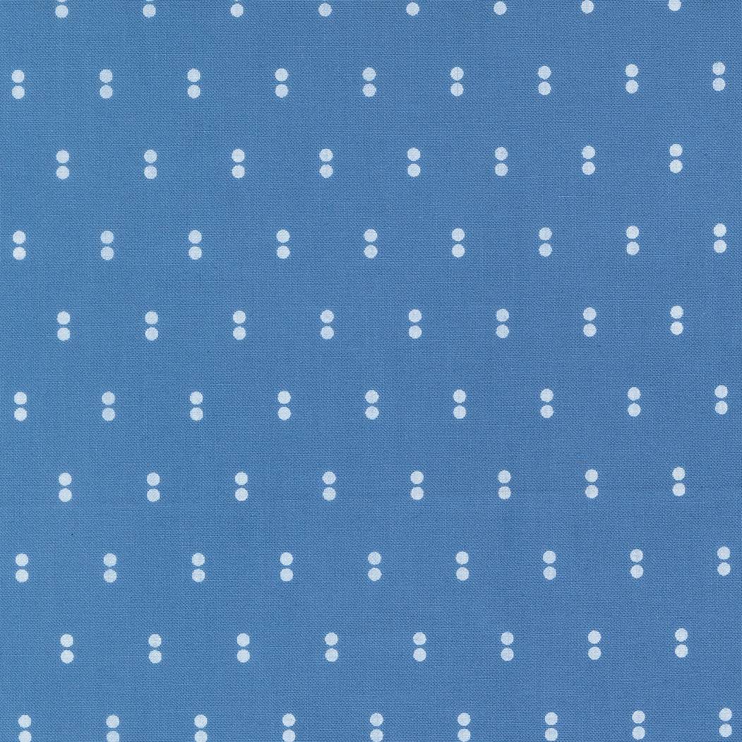 Blueprint Dots Blue fabric by Camille Roskelley for Moda Fabrics with white dots on blue background