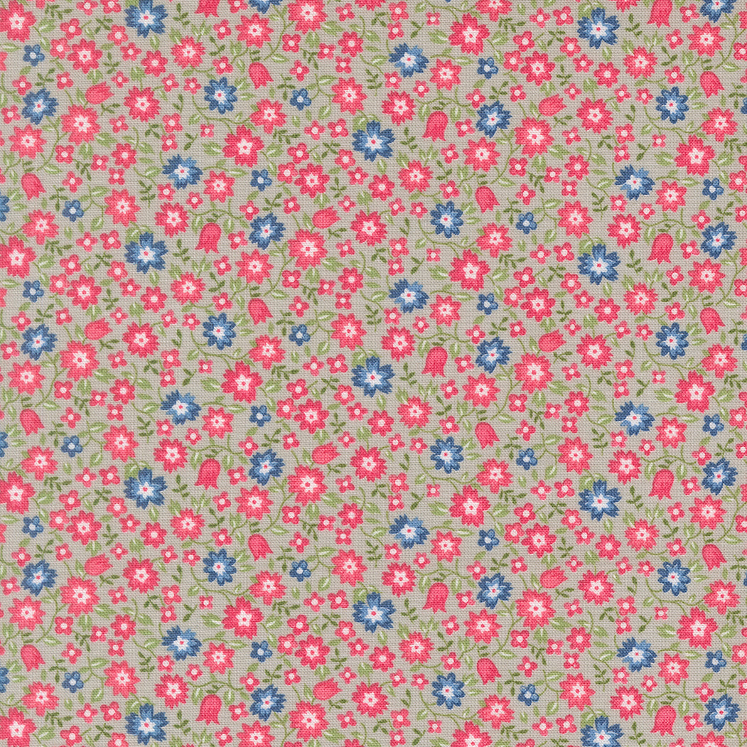 A Cat Named Stitch floral fabric by Camille Roskelley featuring grey kitten and floral patterns for quilting