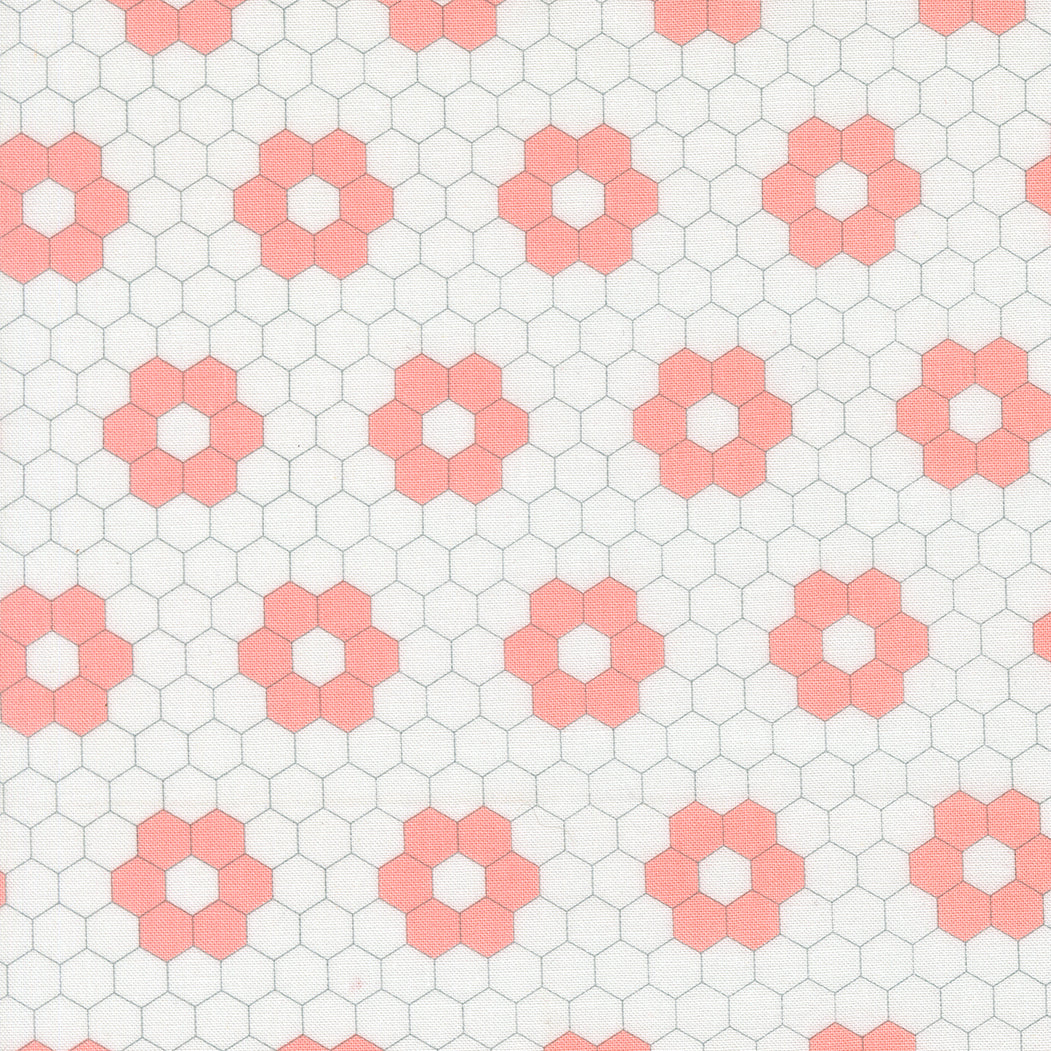 A Cat Named Stitch quilt fabric by Camille Roskelley featuring geometric cream blush hexagons