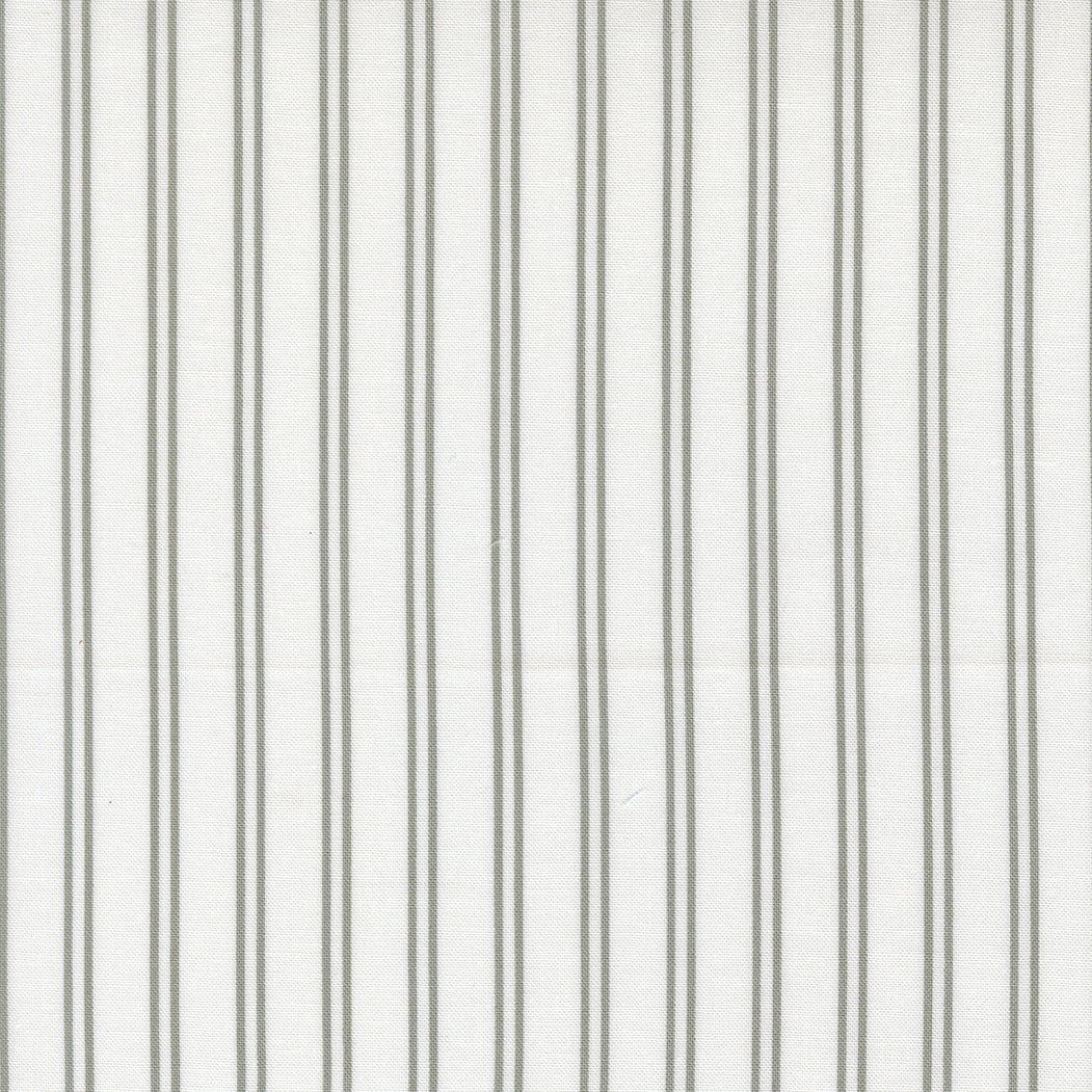 Striped cream and grey fabric featuring cat-themed design A Cat Named Stitch by Camille Roskelley for Moda Fabrics
