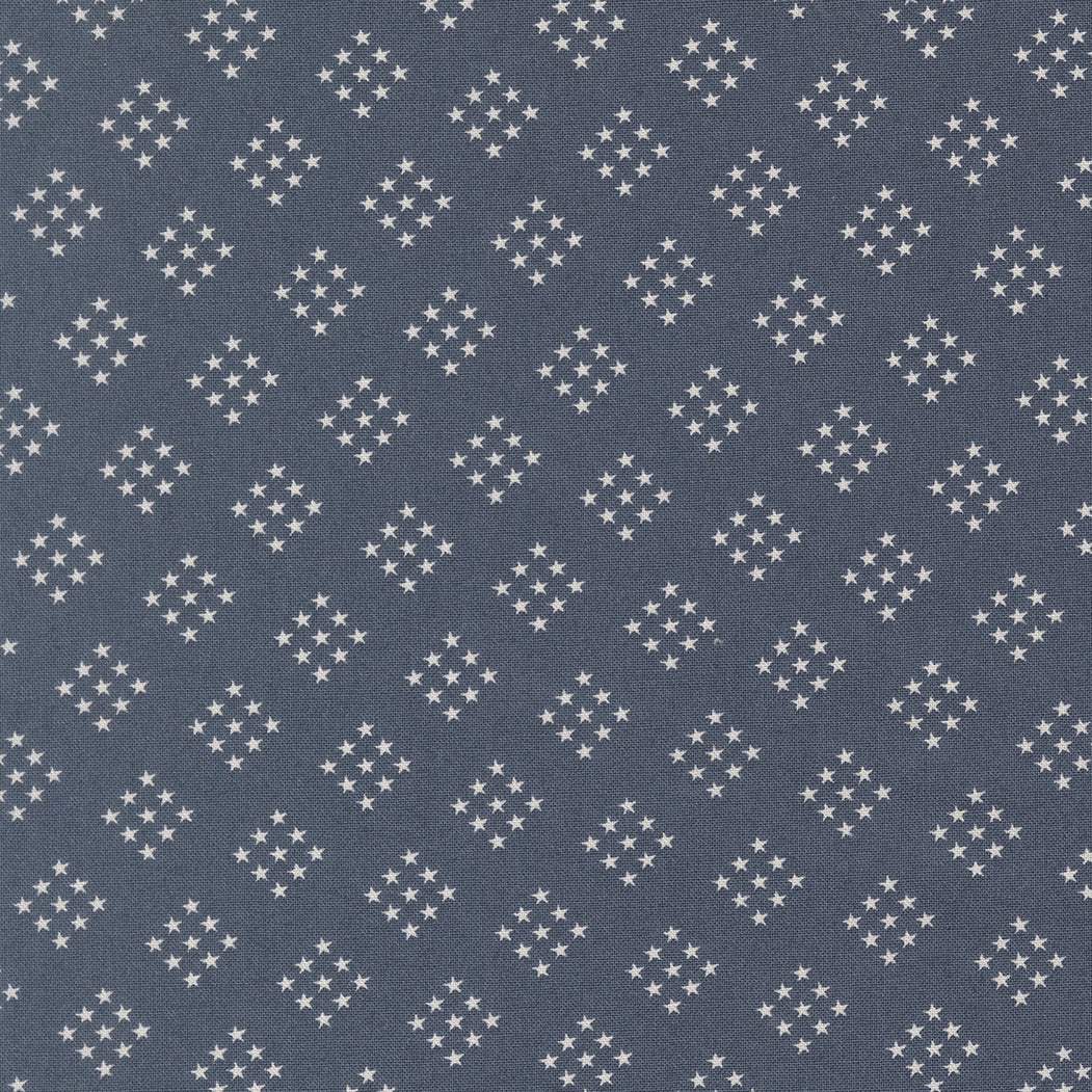Independence Day Stars Indigo fabric pattern with blue background and white stars by Sweetwater for Moda Fabrics