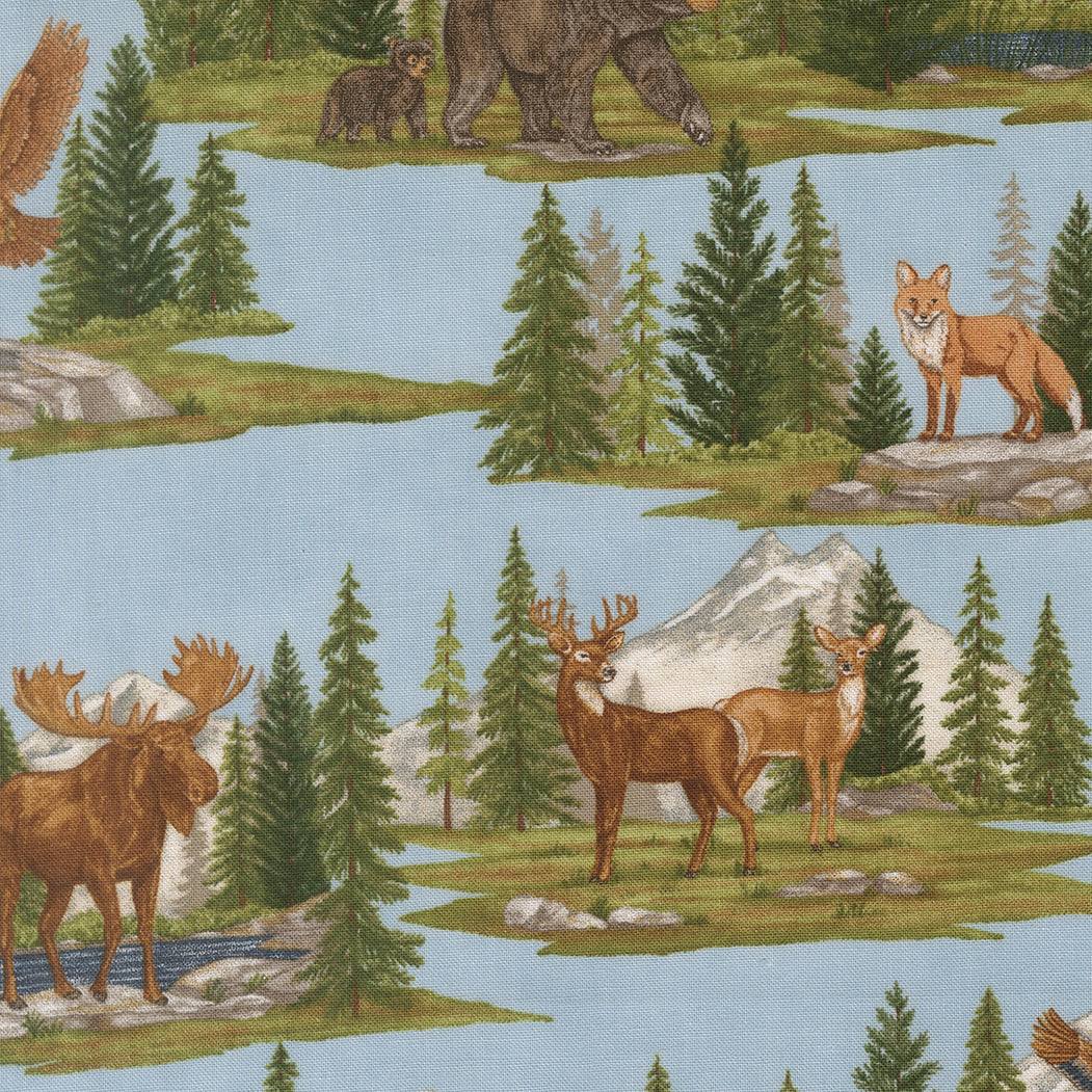 Northwoods Lodge fabric pattern with pine trees, animals, and lake scenes in tans, greens, browns, and blues by Deb Strain for Moda Fabrics