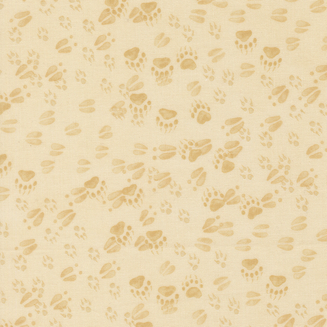 Northwoods Lodge Animal Tracks fabric with pine trees, animal prints, and natural forest elements in earthy tones by Deb Strain for Moda Fabrics