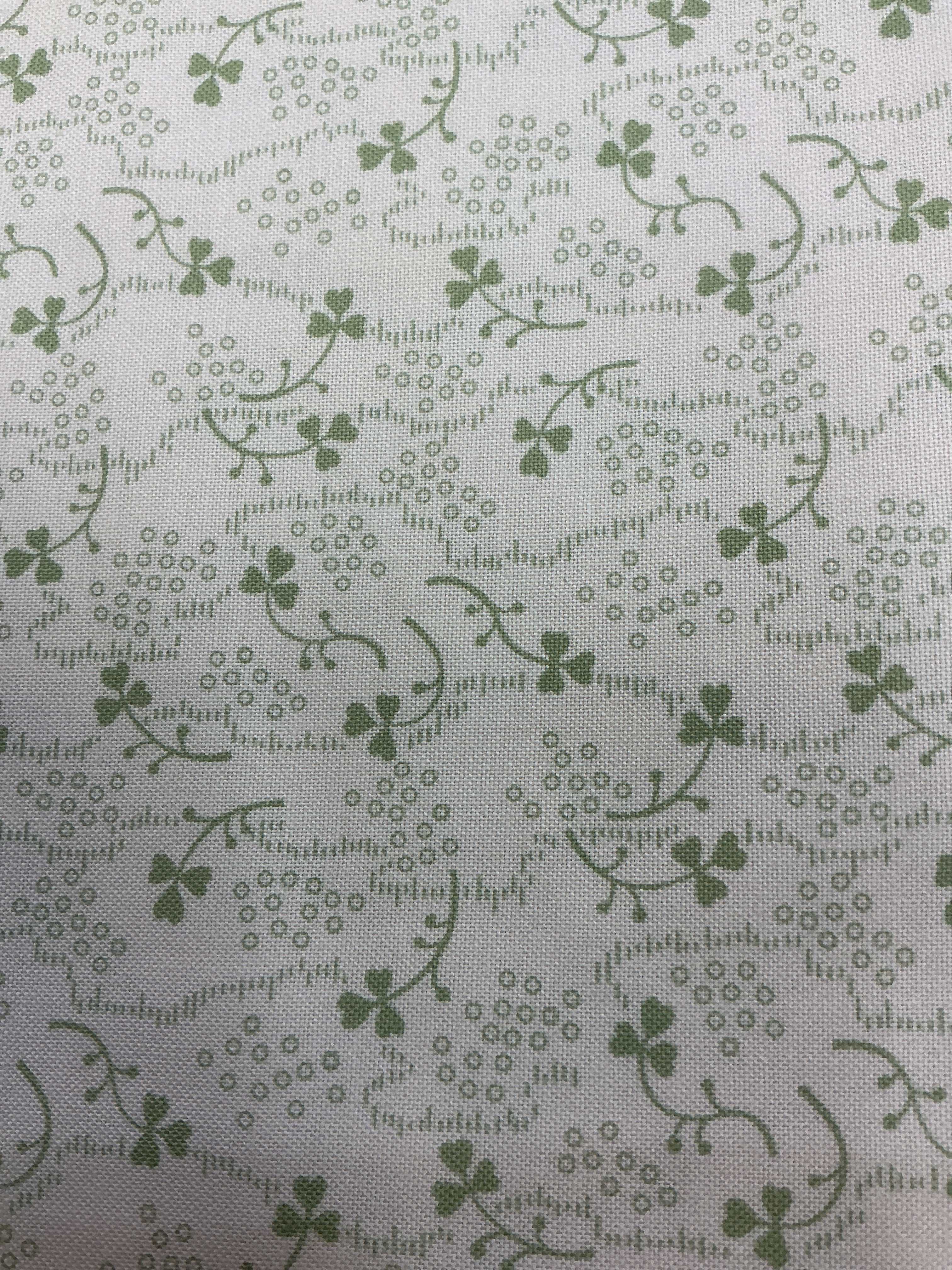 Rolls of fabric labeled 5-yard cuts on sale