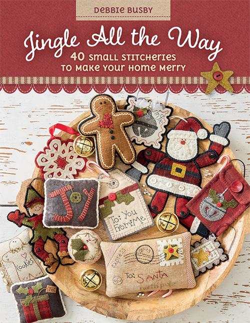 Jingle All the Way Quilt book by Debbie Busby featuring handmade Christmas quilt designs with embroidery and trims