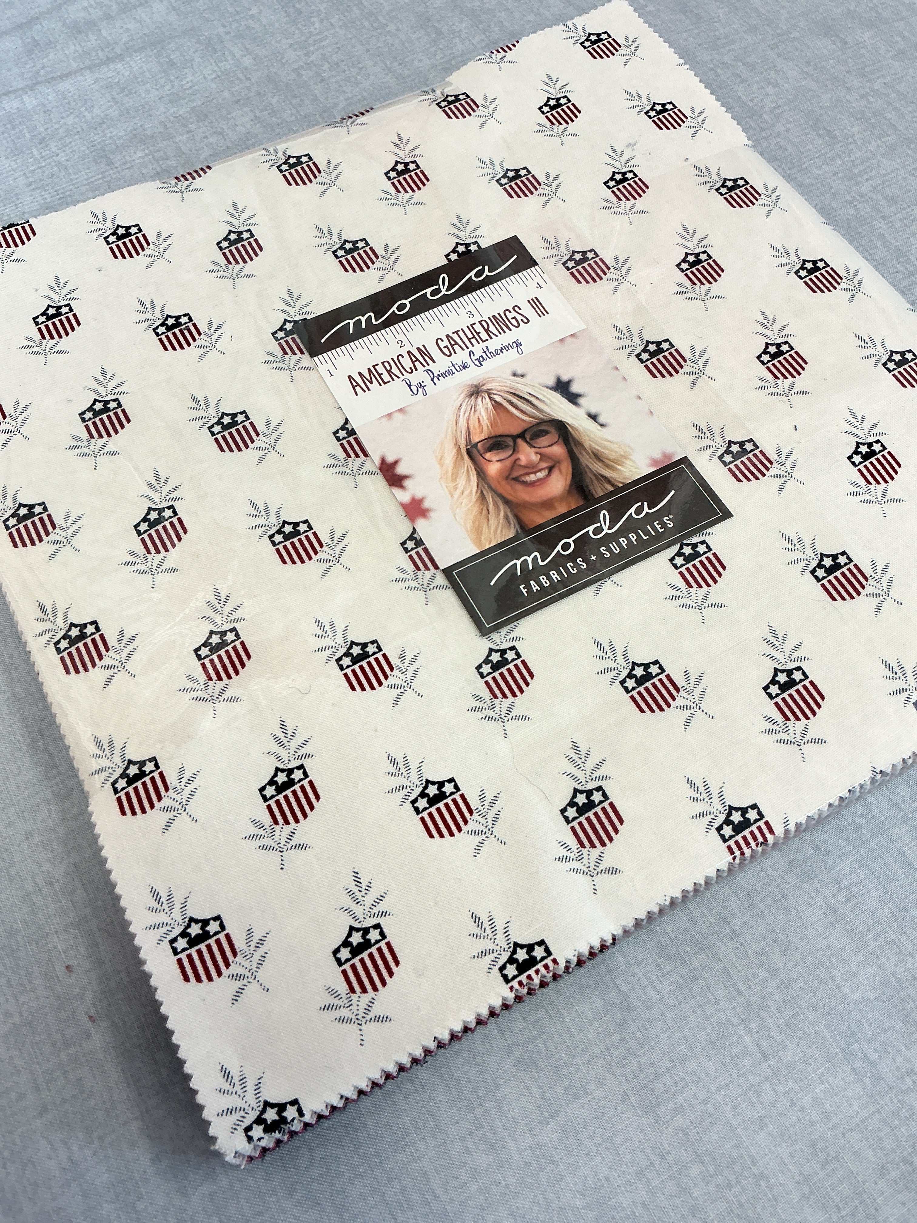 Frida Lap Size Quilt Kit with colorful fabric cuts, free digital pattern, and sewing accessories for a lap-size quilt project