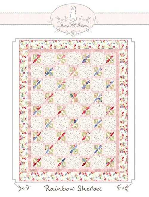 Rainbow Sherbet quilt pattern by Bunny Hill Designs with colorful patchwork and floral border
