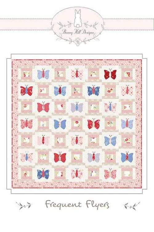 Frequent Flyers quilt pattern with red, blue, and pink butterfly blocks by Bunny Hill Designs
