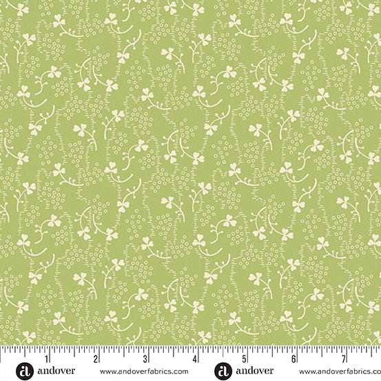 Little Clover fabric by Andover Fabrics with green background and white floral and clover pattern
