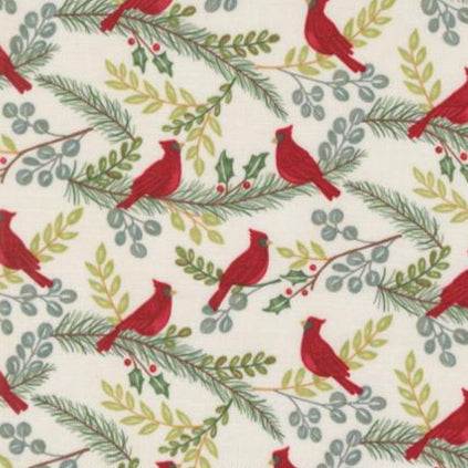 Winter Friends fabric with red cardinals and winter greenery on white background by Deb Strain