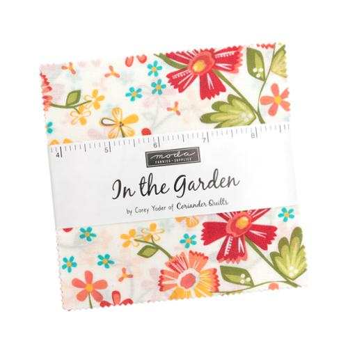 In the Garden Charm Pack by Corey Yoder featuring floral fabric squares with pink, coral, yellow, green, and aqua colors