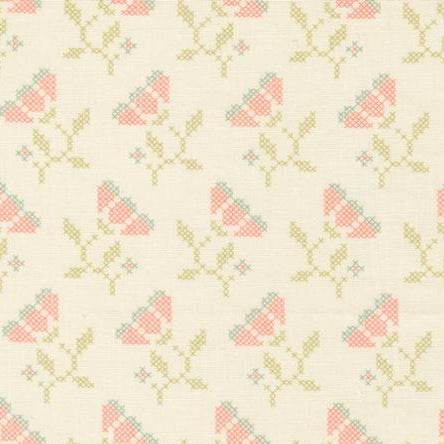 Sunbonnet Blooming Stitches porcelain fabric with delicate floral and vintage-inspired cross-stitch pattern in soft pink, green, and cream tones