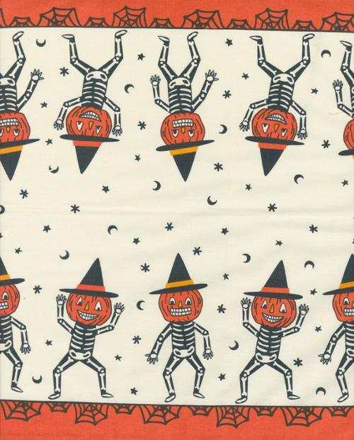 16" Classic Retro Holiday fabric featuring dancing skeletons with pumpkin heads and witch hats in a Halloween motif on 16-inch wide cotton toweling