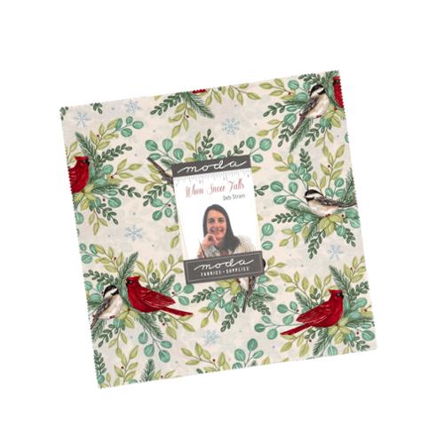 When Snow Falls Layer Cake fabric squares featuring cardinals, chickadees, winter stockings, and festive greenery in red and green tones