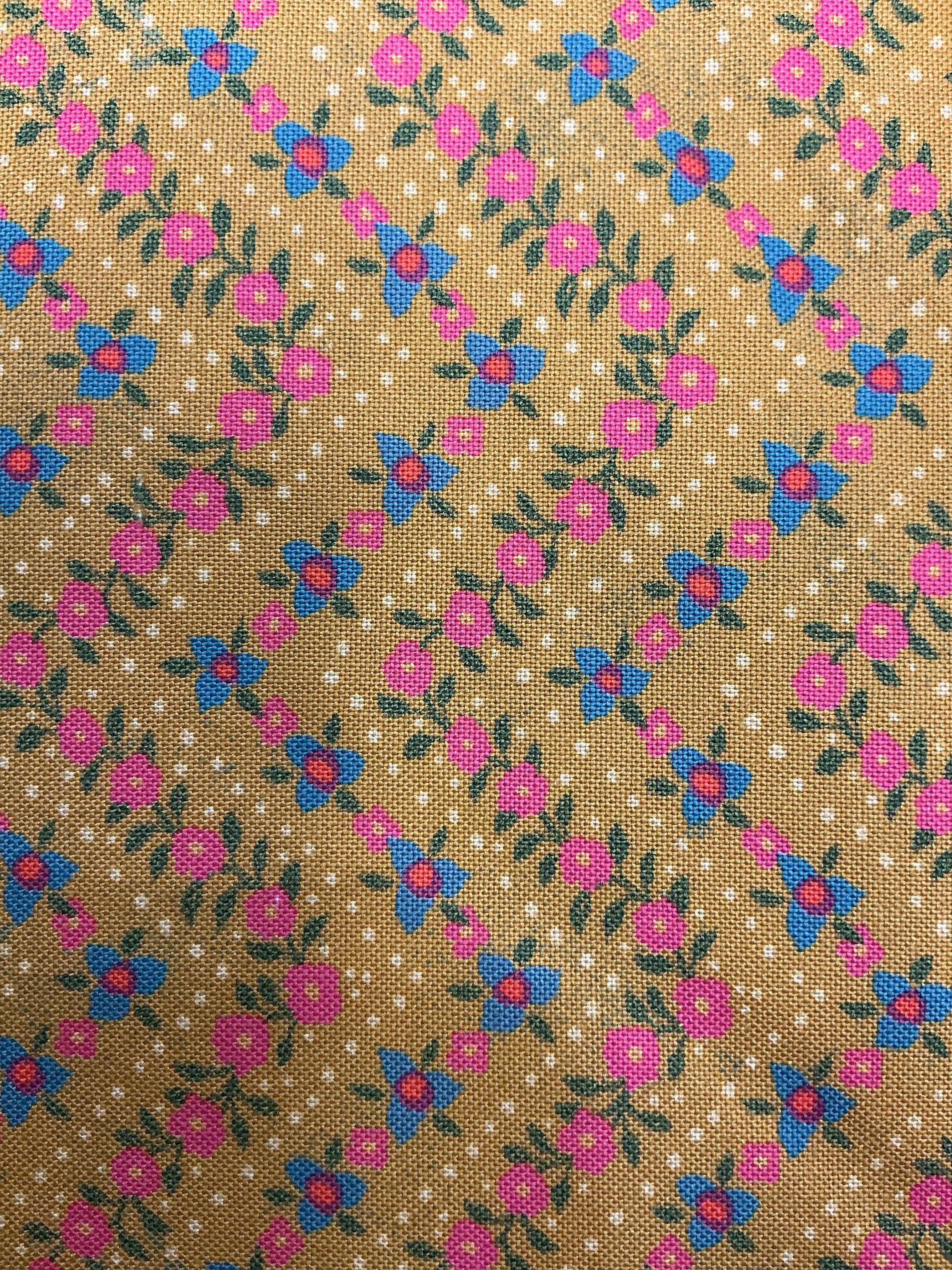 5-yard Cuts fabric sale display with variety of colorful fabrics
