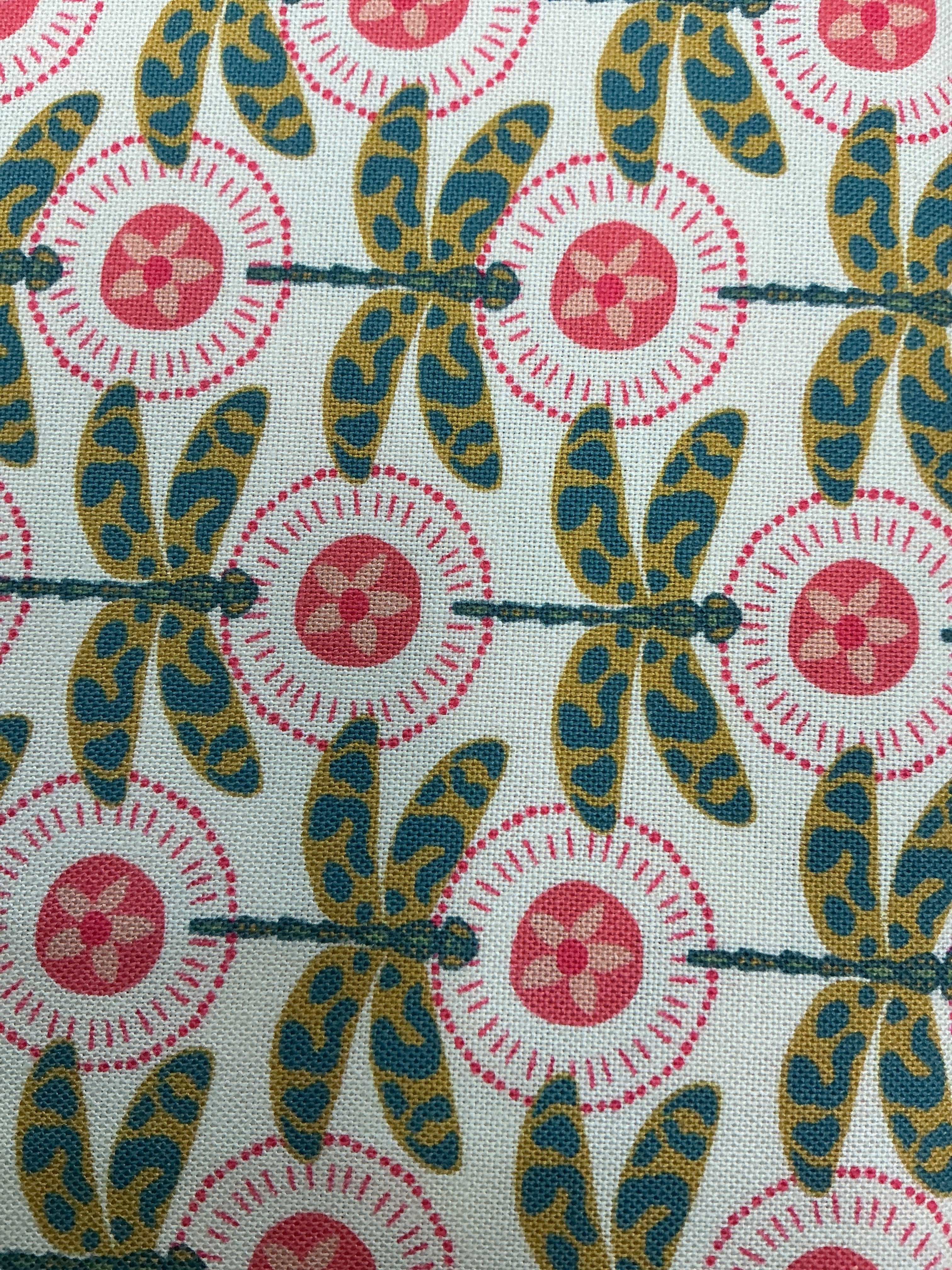 5-yard Cuts fabric sale with colorful fabric rolls stacked