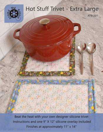 Extra large Hot Stuff Trivet by Lisa Amundson with printed pattern and heat-resistant silicone overlay for hot dishes
