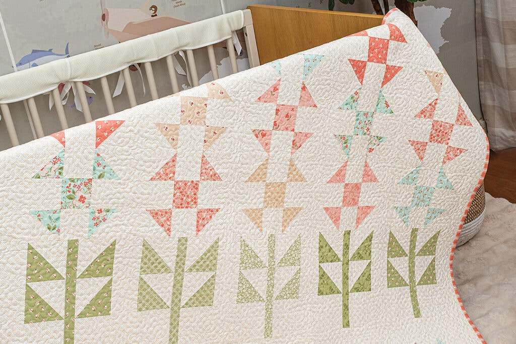 Bluebonnets Quilt Kit with pastel floral and geometric patterns in 63x73 inch quilt top and binding
