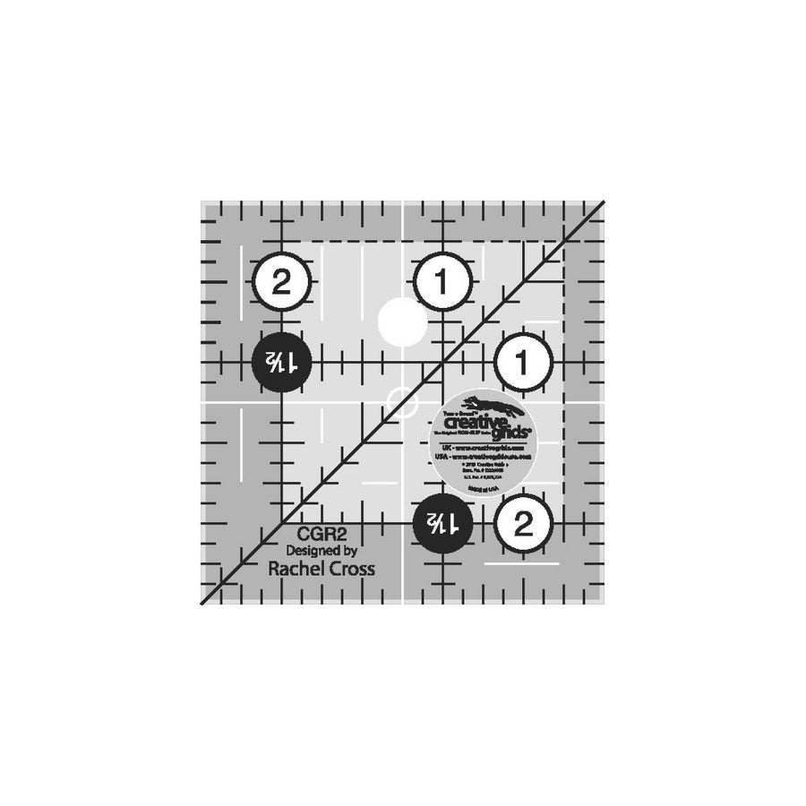 Creative Grids 2.5 inch quilting ruler with black and white markings, 1/8 and 1/4 inch increments, 45-degree angle, and non-slip grip