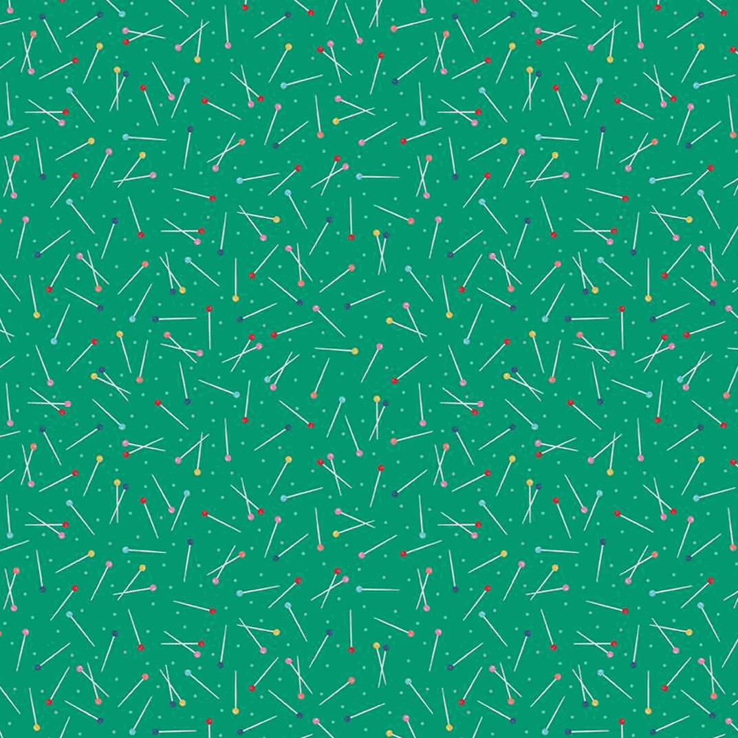 Hand Made Green Pins fabric by Amber Kemp-Gerstel with colorful sewing pin pattern on green background