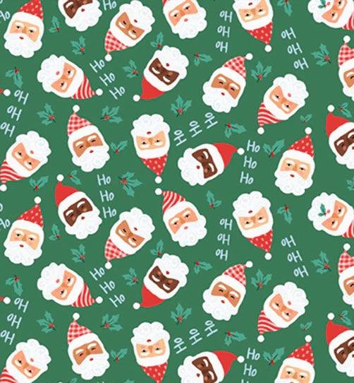 Christmas Miniatures III fabric with diverse Santa faces on green background by Pink Light Studios