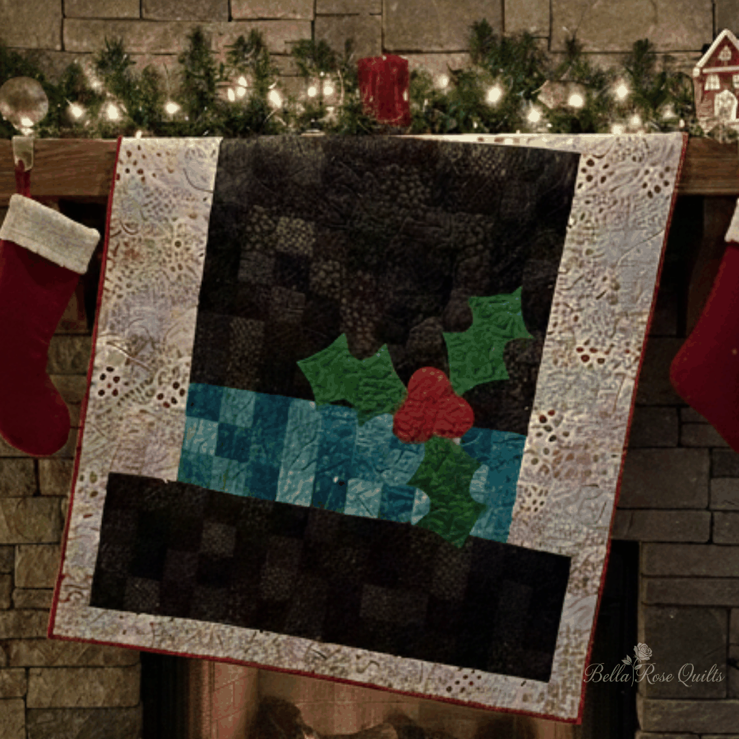 Frosty's Magic Hat Quilt Kit with festive patchwork and applique pattern by Bella Rose Quilts, 72x76.5 inches.