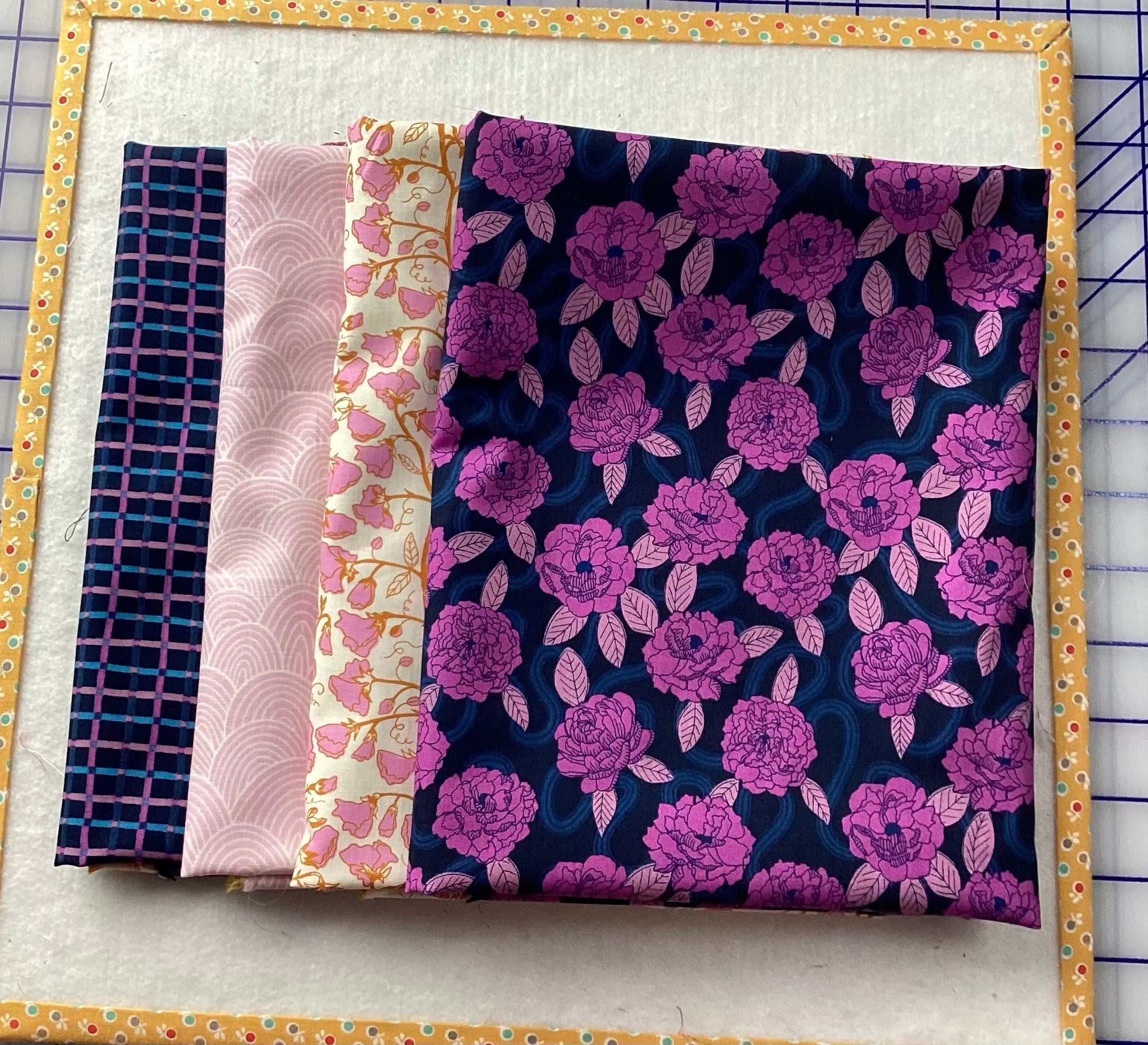 4-yard quilt fabric bundle with purple floral, pink scallop, cream floral, and navy check patterns