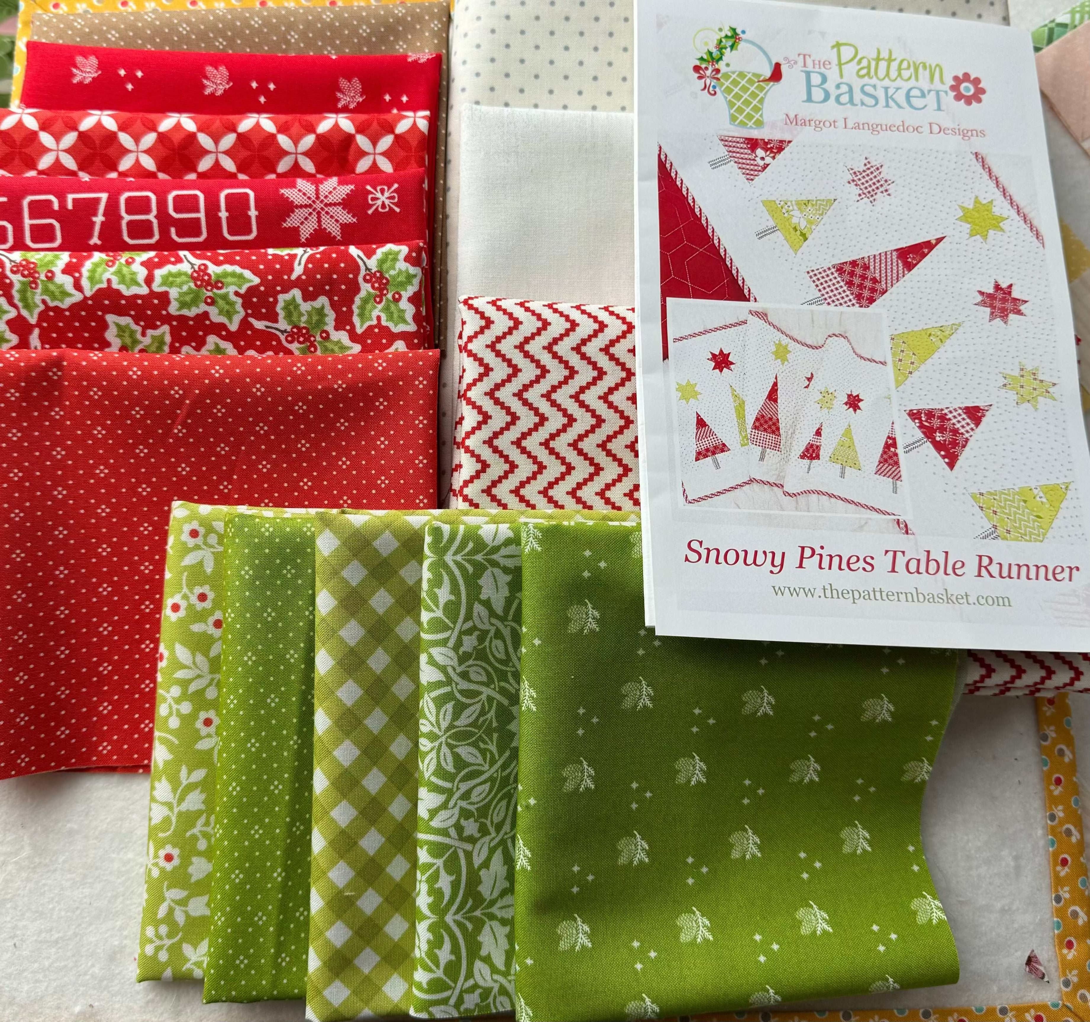 Snowy Pines Table Runner kit with red and green holiday fabric and pattern instructions