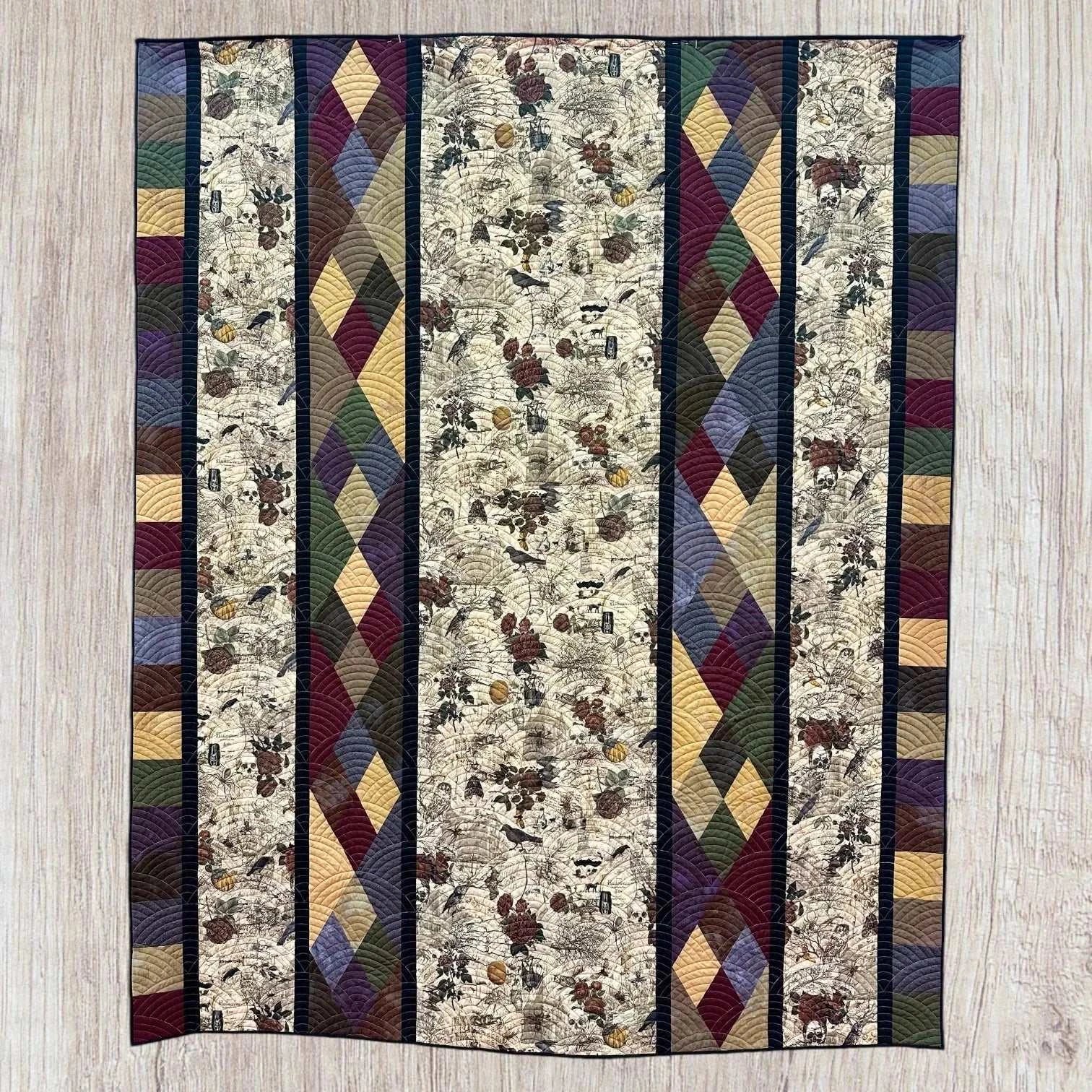 Montage Quilt Kit featuring Haunted Mansion fabric with diamond patterns and themed panels