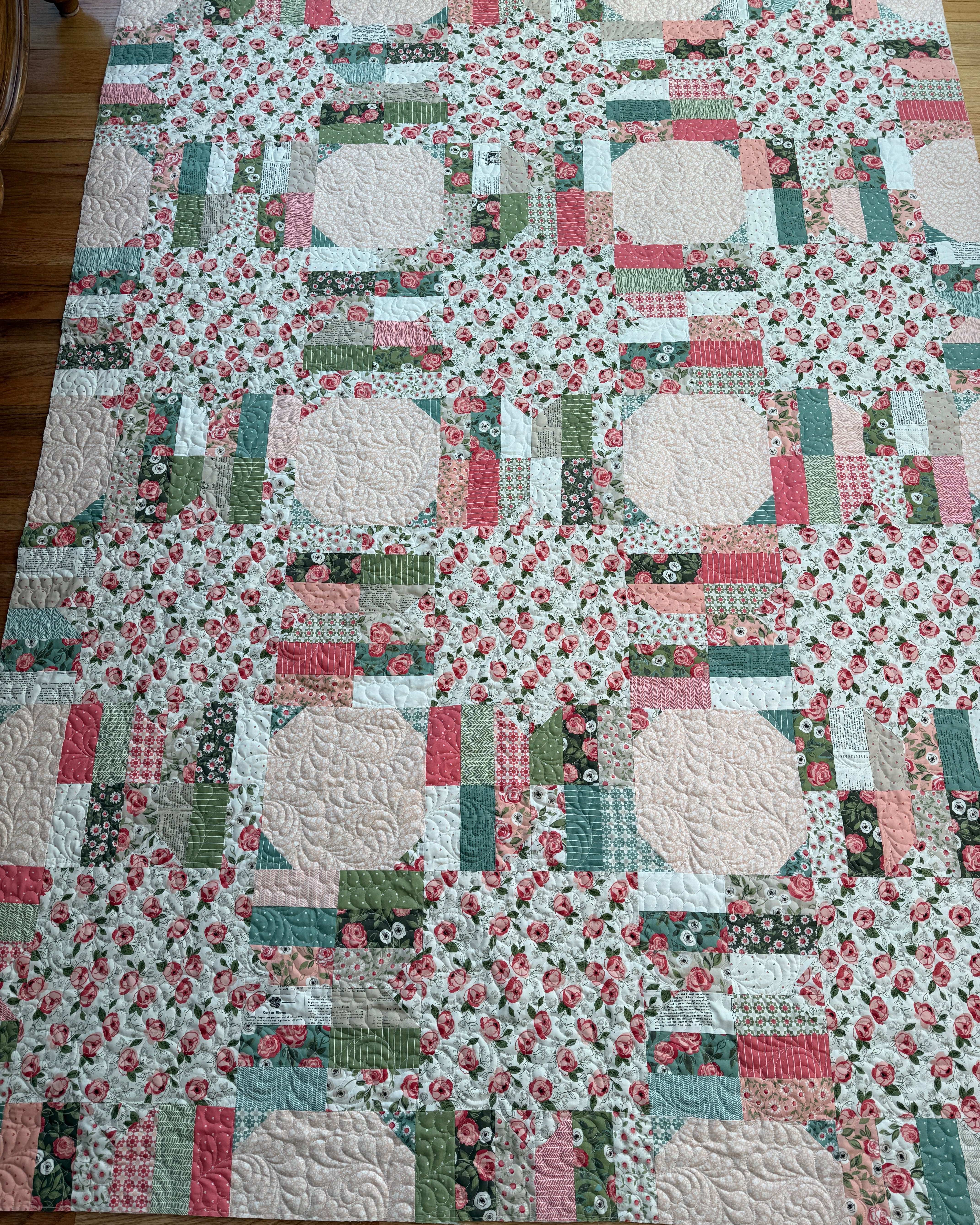 Project Jelly Roll Kit Luster Quilt featuring Lovestruck floral fabric in pink, green, and cream colors, 65 x 86.5 inches